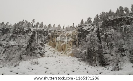 Amazing frozen waterfall in winter in north Finland