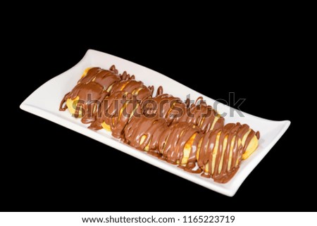 pan cake in different view inside a white plate with a black background