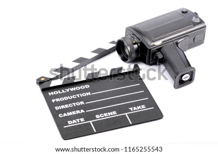 Old camera and movie clapper board, isolated , movie industry concept 