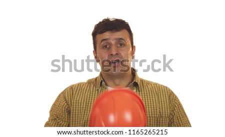 Worried mature male constructionist contractor looking shocked taking off his hardhat emotions expressive job unexpected problem failure guilty building engineering repairing handyman. Royalty-Free Stock Photo #1165265215