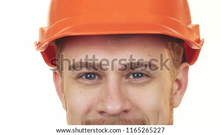 Sliding cropped close up of the blue eyes of handsome bearded constructionist wearing hardhat smiling happiness profession job repairman handyman occupation confidence career success. Royalty-Free Stock Photo #1165265227