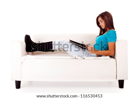 Young happy woman studying on a couch