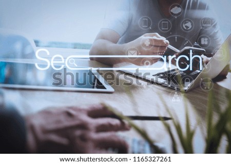 Searching Browsing Internet Data Information Networking Concept with blank search bar.Designer Businessman hand using smart phone,mobile payments online shopping with digital tablet docking keyboard.