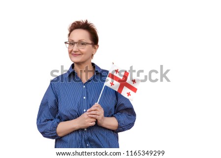 Georgia flag. Woman holding Georgia flag. Nice portrait of middle aged lady 40 50 years old with a national flag isolated on white background.