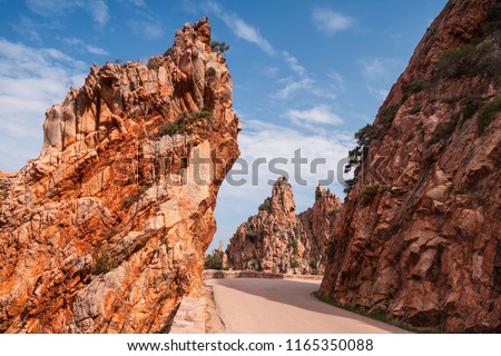 Mountain road in Calanques de Piana. Corsican red rocks located in Piana, between Ajaccio and Calvi, in the gulf of Porto Royalty-Free Stock Photo #1165350088