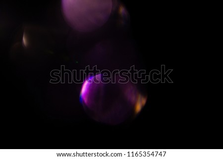 Lens flare overlay texture on black background