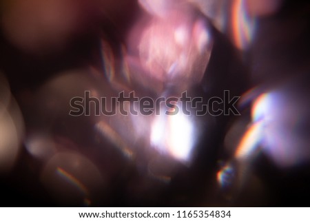 Lens flare overlay texture on black background