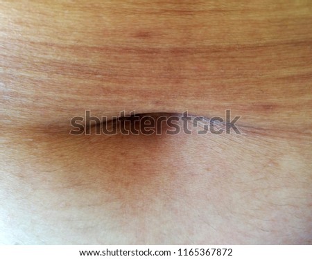 Closeup of lady belly button. Lady's navel.