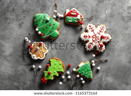 Frame made of Christmas cookies on grey background