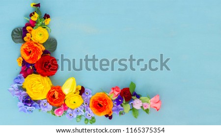 Flowers festive composition on blue  table with copy space