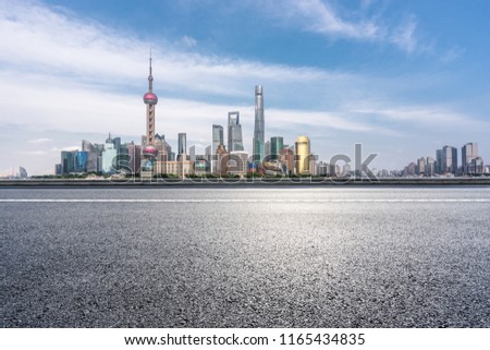 empty asphalt road with city skyline in shanghai china