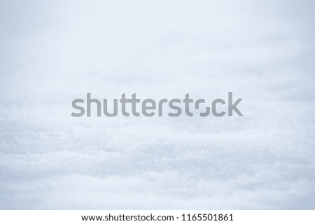 Snow top on blur white snowfall background for display or montage product