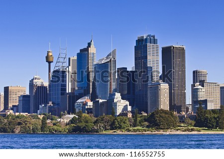 Australia Sydney downtown CBD towers and skyscrapers view from ferry over Royal Botanic Garden bright summer sunny day