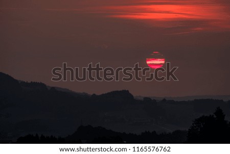 the early morning rising sun in austria in summer