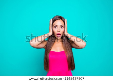 People person reaction concept. Close up photo portrait of impressed with big eyes long brown hair clothed in stylish modern apparel lady covering ears with hands isolated bright vivid background