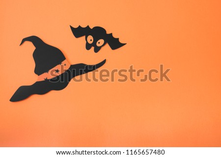 Black paper halloween decorations with orange backgorund