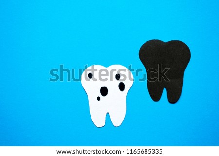 A sick tooth against a healthy background.
