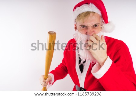 Santa Claus with a baseball bat, the concept of an evil Santa Claus for Christmas
