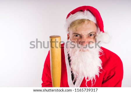Santa Claus with a baseball bat, the concept of an evil Santa Claus for Christmas
