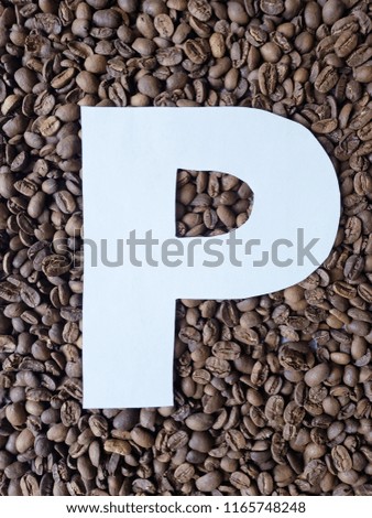 letter P in white and background with roasted coffee beans 