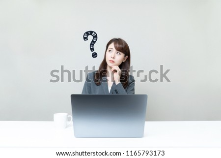 Young businesswoman having questions.