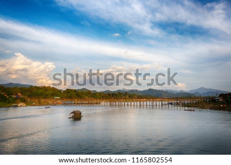Panorama of beautiful sunrise scene at old an long wooden bridge at Sangklaburi,Kanchanaburi province, Thailand