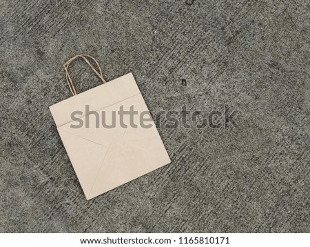 Big base brown Paper bag Shopping bag Vintage bag isolated on vintage background