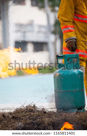 Firefighter with fire and suit for protect fire fighter for training firefighters.