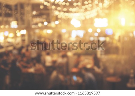 Blur people in restaurant. abstract bokeh in night party for background
- vintage effect style picture 
