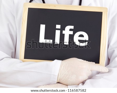 Doctor shows information on blackboard: life
