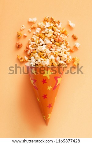 pop corn on orange background