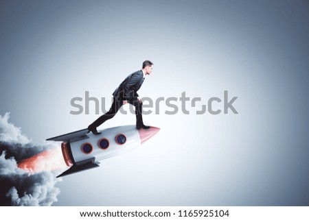 Businessman on creative launching rocket. Startup and career concept. Royalty-Free Stock Photo #1165925104