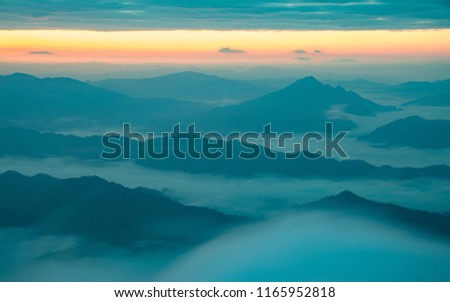Beautiful mountains and sea of fog in the early morning of Northern Thailand. Natural background. Royalty-Free Stock Photo #1165952818