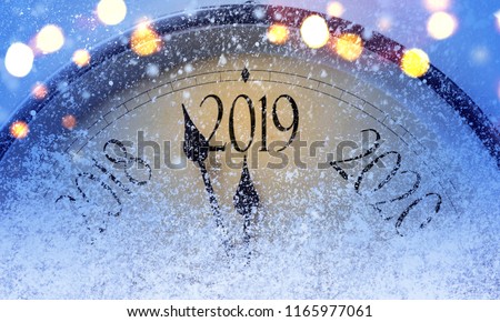 Countdown to midnight. Retro style clock counting last moments before Christmass or New Year 2019. Royalty-Free Stock Photo #1165977061