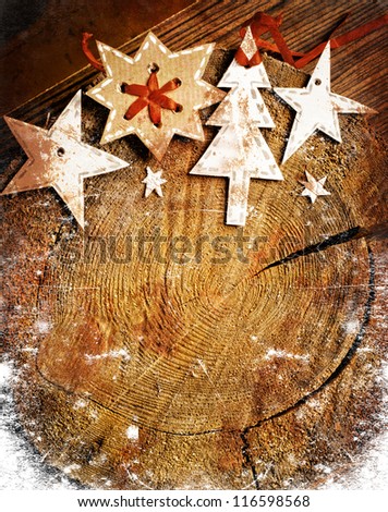 Christmas decoration over grunge  background/vintage paper christmas decoration with a sign and red ribbon