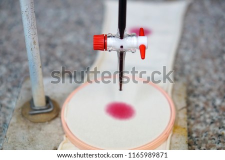 Colour and pigment solvent base test in textile laboratory                                Royalty-Free Stock Photo #1165989871