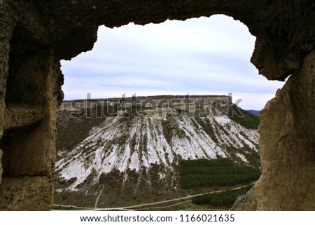 Panoramic view of the plateau of the mountain and the valley from the window of the Judean fortress of the ancient cave city