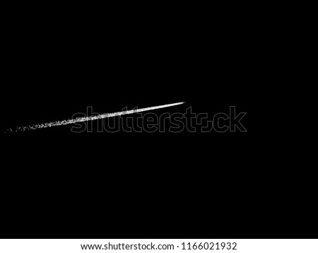 Flight contrail as background / Contrails are line-shaped clouds produced by aircraft engine exhaust or changes in air pressure, typically at aircraft cruise altitudes several miles above the Earth's  Royalty-Free Stock Photo #1166021932