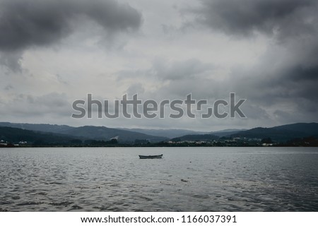 Landscape of a fishing boat on the sea with clouds