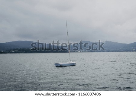 Landscape of a fishing boat on the sea with clouds