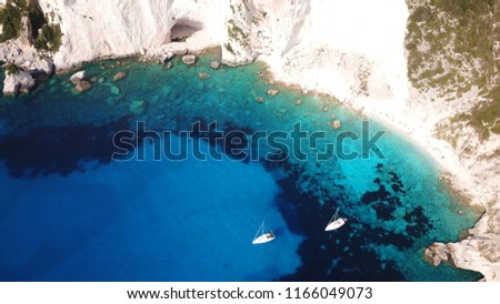 Aerial drone bird's eye view photo of tropical white rocky bay of Erimitis with turquoise clear waters and sail boats docked, island of Paxos, Ionian, Greece