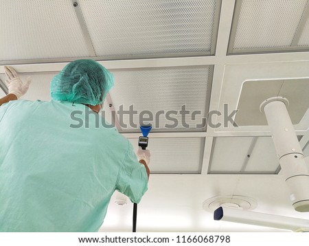 Technician working PAO or DOP - HEPA Filter Integrity Test and Airflow Visualization Test. Royalty-Free Stock Photo #1166068798