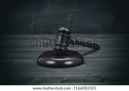 Law and Justice, Legality concept, Judge Gavel on a black wooden background.
