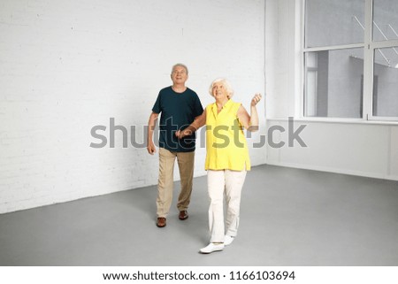 Happy mature couple in their new house