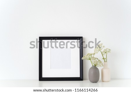 Black portrait square frame mock up with a episcopal weed in little vases grau and white. Mockup for quote, promotion, headline, design. Template for small businesses, lifestyle bloggers, social media