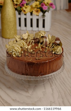 delicious beautiful delicate chocolate cake decorated with hearts and roses