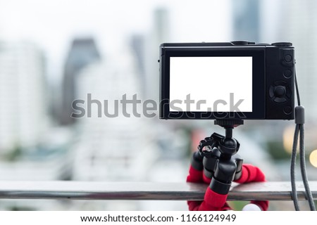 Compact digital camera using squid tripod during time lapse or slow speed shutter.
