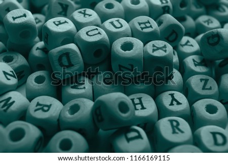 cubes beads letters alphabet / background of wooden cubes with alphabet letters, concept education reading, learning letters