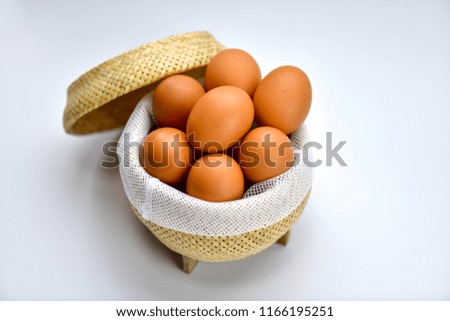Eggs in bamboo basket.