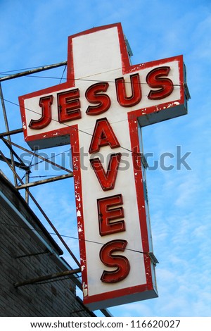Jesus Saves. Old "Jesus Saves" neon sign off the side of an old building in Toronto, Canada.